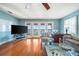 Bright living room includes hardwood floors, French doors and a ceiling fan at 6663 Bayou Grande Ne Blvd, St Petersburg, FL 33702