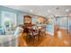 Open concept living and dining area features hardwood floors and bright lighting at 6663 Bayou Grande Ne Blvd, St Petersburg, FL 33702