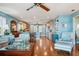 Open concept living space featuring wood floors, chairs and eat-in kitchen at 6663 Bayou Grande Ne Blvd, St Petersburg, FL 33702