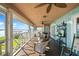Inviting screened porch with rocking chairs and peaceful waterfront views for relaxing and entertaining at 6663 Bayou Grande Ne Blvd, St Petersburg, FL 33702