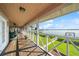 Waterfront porch offering scenic views, seating areas, and tranquil outdoor living space at 6663 Bayou Grande Ne Blvd, St Petersburg, FL 33702