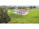 Expansive lawn with verdant grass and a contemporary style home with balcony and outdoor living space at 6707 Josie Dr, Seffner, FL 33584