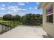 Open-air balcony with iron railing showcasing green landscape views at 6707 Josie Dr, Seffner, FL 33584
