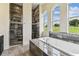 Bathroom with tiled showers and soaking tub with tiled surround under bright windows at 6707 Josie Dr, Seffner, FL 33584