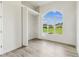 Bedroom with a large window that overlooks a spacious yard and a closet at 6707 Josie Dr, Seffner, FL 33584