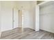 Bedroom with light wood flooring, large closet and a door leading to the foyer at 6707 Josie Dr, Seffner, FL 33584