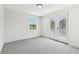 Bright bedroom with neutral carpet, and access to the outside at 6707 Josie Dr, Seffner, FL 33584