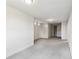 An empty bonus room with soft gray carpeting, recessed lighting, and multiple windows at 6707 Josie Dr, Seffner, FL 33584