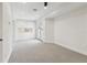 Spacious bonus room with gray carpet and double doors leading to an outdoor patio at 6707 Josie Dr, Seffner, FL 33584