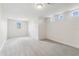 Cozy bonus room with soft gray carpeting and natural light from the window at 6707 Josie Dr, Seffner, FL 33584