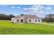 Expansive single-story home with stucco exterior, red tile roof and sprawling green lawn at 6707 Josie Dr, Seffner, FL 33584