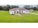 Beautiful single-story home with a tile roof and lush green lawn at 6707 Josie Dr, Seffner, FL 33584