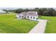 Beautiful home with lush lawn, brick accents, tile roof, and a paved driveway at 6707 Josie Dr, Seffner, FL 33584