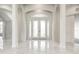 Grand foyer boasts high ceilings, marble floors, and decorative glass front doors at 6707 Josie Dr, Seffner, FL 33584
