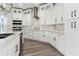 Close up of bright kitchen featuring stainless steel appliances, and white cabinets at 6707 Josie Dr, Seffner, FL 33584