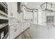 Close up of bright kitchen featuring stainless steel appliances, and white cabinets at 6707 Josie Dr, Seffner, FL 33584