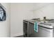 Laundry room with new washer and dryer machines, a shelf and electrical outlets, ready for household tasks at 6707 Josie Dr, Seffner, FL 33584
