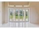 Beautiful living room featuring marble floors and sliding glass doors that lead to the backyard at 6707 Josie Dr, Seffner, FL 33584
