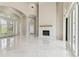 Open living space features marble floors, modern fireplace, and glass doors offering access to the outdoors at 6707 Josie Dr, Seffner, FL 33584