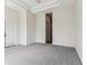 Large main bedroom with carpeted flooring and a door for outdoor access at 6707 Josie Dr, Seffner, FL 33584