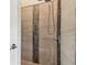 Modern shower featuring decorative tiling and a sleek shower head fixture at 6707 Josie Dr, Seffner, FL 33584