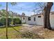 A spacious backyard boasts a patio, mature trees, and ample space for outdoor living and entertaining at 711 19Th S Ave, St Petersburg, FL 33705
