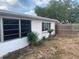 View of the backyard with a view of the home's exterior at 7519 Kensico Dr, Port Richey, FL 34668