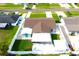 Aerial view of a fenced home featuring a detached garage and covered parking at 7909 Woodgrove Cir, Tampa, FL 33615