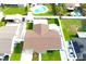 Aerial view showcasing a well-maintained property with a fenced backyard and inviting swimming pool at 7909 Woodgrove Cir, Tampa, FL 33615