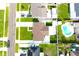 Aerial view of a home and backyard featuring an in-ground pool at 7909 Woodgrove Cir, Tampa, FL 33615
