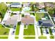 Aerial view of a home featuring a well-maintained yard, fenced perimeter and an outbuilding at 7909 Woodgrove Cir, Tampa, FL 33615