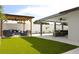 Backyard featuring outdoor seating areas and artificial turf at 7909 Woodgrove Cir, Tampa, FL 33615