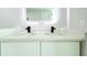 Bright bathroom featuring dual sinks, quartz counters and modern black faucets at 7909 Woodgrove Cir, Tampa, FL 33615