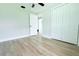An empty bedroom featuring wood-look flooring and a closet at 7909 Woodgrove Cir, Tampa, FL 33615