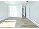 A view of the bedroom featuring a closet and wood-look flooring at 7909 Woodgrove Cir, Tampa, FL 33615