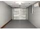 Garage interior showing concrete block walls, mini split, and epoxy floor at 7909 Woodgrove Cir, Tampa, FL 33615