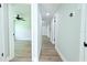 Hallway and bedroom showcasing new paint and flooring at 7909 Woodgrove Cir, Tampa, FL 33615