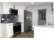 Updated kitchen featuring stainless steel appliances and custom backsplash at 7909 Woodgrove Cir, Tampa, FL 33615