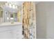 Bathroom with shower/tub combination, vanity and framed mirror at 8198 Terrace Garden Dr # 511, St Petersburg, FL 33709