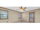 Cozy bedroom with carpet, windows offering natural light, and access to exterior at 8198 Terrace Garden Dr # 511, St Petersburg, FL 33709