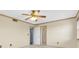 Bright, neutral bedroom featuring carpeted floors, trim molding and ensuite bathroom access at 8198 Terrace Garden Dr # 511, St Petersburg, FL 33709