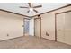 Bedroom featuring carpeted floors, ceiling fan and closet storage at 8198 Terrace Garden Dr # 511, St Petersburg, FL 33709