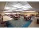 Bright common room with tables, chairs, and ample space for community gatherings and social events at 8198 Terrace Garden Dr # 511, St Petersburg, FL 33709