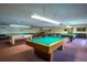 Spacious game room featuring multiple billiard tables and ample lighting for recreational enjoyment at 8198 Terrace Garden Dr # 511, St Petersburg, FL 33709