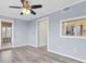 Living room with wood floors and neutral paint, adjacent to kitchen through passthrough at 8198 Terrace Garden Dr # 511, St Petersburg, FL 33709