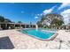 Large outdoor swimming pool with clear blue water, lounge chairs, and sun-soaked deck area at 8198 Terrace Garden Dr # 511, St Petersburg, FL 33709