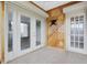 Indoor sunroom with tile floor, access to main room, and full glass exterior door at 8198 Terrace Garden Dr # 511, St Petersburg, FL 33709