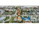 Aerial view shows property location in neighborhood near beach, with pool, and terracotta roof at 831 Mandalay Ave, Clearwater, FL 33767