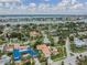 Beautiful aerial view of the neighborhood with homes and waterways at 831 Mandalay Ave, Clearwater, FL 33767