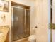 Features a glass-enclosed shower with tiled walls and a granite vanity, creating a modern and stylish space at 831 Mandalay Ave, Clearwater, FL 33767
